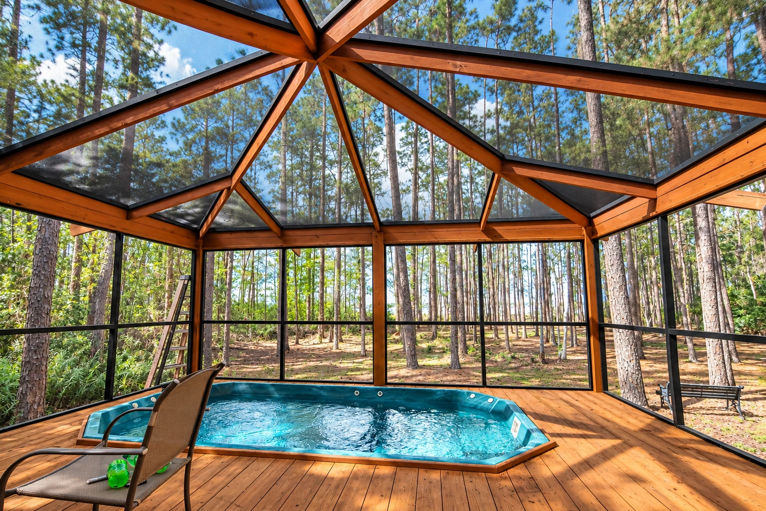 A wooden patio enclosure with dark screens and a peaked glass roof surrounds an in-ground pool in a wooded setting.